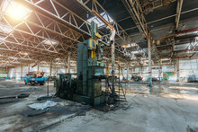Abandoned Factory. Large Empty Ruined Industrial Hall With Broken Remnants Of Equipment
