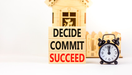 Wall Mural - Decide commit succeed symbol. Concept word Decide Commit Succeed on beautiful wooden block. Black alarm clock. Beautiful white table background. Business decide commit succeed concept. Copy space.