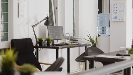 Wall Mural - Professional department office with workstation desks, empty open space filled with corporation equipment and pcs. Modern startup agency workspace in boardroom coworking space.