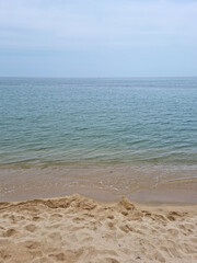 Wall Mural - Soft beautiful ocean wave on sandy beach. Beach landscape.