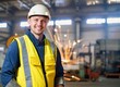 © sunchai - Portrait Heavy Industry Engineer Male Worker Wearing Safety Vest and Hardhat Smiling on Camera. In the Background Unfocused Large Industrial Factory.AI-Generated.