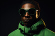 © vefimov - Man wearing sunglasses and green jacket. Versatile image suitable for various concepts and contexts.