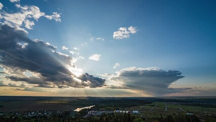 Wall Mural - beautiful movement of fluffy clouds with clear blue sky. dramatic clouds at sunset, aerial view of s