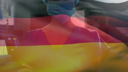 Canvas Print - Animation of waving germany flag against portrait of caucasian female surgeon at hospital