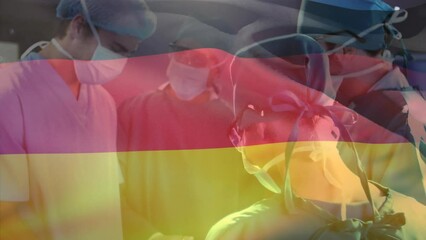 Sticker - Animation of waving germany flag against team of diverse surgeons performing operation at hospital