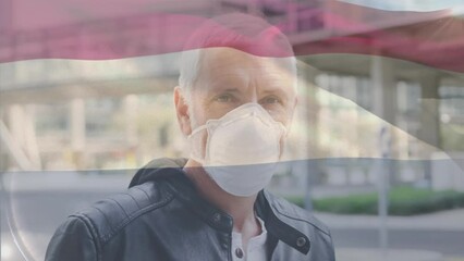 Poster - Animation of waving netherlands flag over portrait of caucasian man wearing face mask on the street