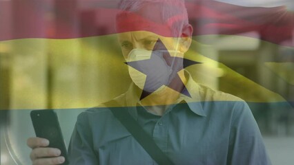 Poster - Animation of waving ghana flag against caucasian man in face mask using smartphone on the street