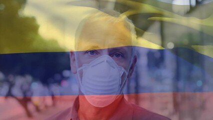 Poster - Animation of waving colombia flag over portrait of caucasian man wearing face mask on the street