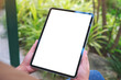 Leinwandbild Motiv Mockup image of a woman holding digital tablet with blank white desktop screen