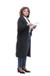 © ASDF - in full growth. mature woman with a digital tablet.