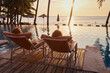 © Song_about_summer - beach travel, happy couple near swimming pool of hotel, summer holidays, vacation getaway
