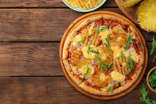 Delicious Pineapple Pizza And Ingredients On Wooden Table, Flat Lay. Space For Text