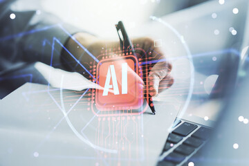 Poster - Double exposure of creative artificial Intelligence abbreviation with hand writing in notepad on background with laptop. Future technology and AI concept