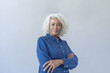 © ReeldealHD images - Studio portrait of a confident senior woman with her arms folded