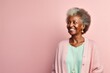 Portrait of a Kenyan woman in her 80s wearing a chic cardigan against a pastel or soft colors background