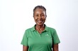© Leon Waltz - medium shot portrait of a confident Kenyan woman in her 60s wearing a sporty polo shirt against a white background