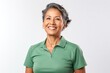 © Anne-Marie Albrecht - Portrait of a confident Mexican woman in her 50s wearing a sporty polo shirt against a white background