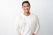 © Leon Waltz - medium shot portrait of a Filipino man in his 30s wearing a chic cardigan against a white background