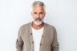 © Leon Waltz - medium shot portrait of a Israeli man in his 50s wearing a chic cardigan against a white background