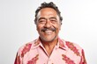 © Anne-Marie Albrecht - medium shot portrait of a happy Mexican man in his 50s wearing a chic cardigan against a white background