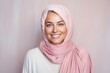 © Anne-Marie Albrecht - medium shot portrait of a happy Polish woman in her 30s wearing a charming scarf against a pastel or soft colors background