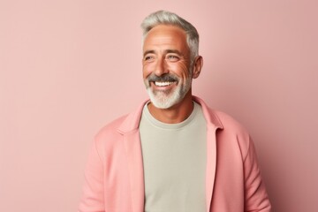 Wall Mural - medium shot portrait of a Israeli man in his 50s wearing a chic cardigan against a pastel or soft colors background