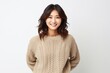 © Leon Waltz - portrait of a Japanese woman in her 30s wearing a cozy sweater against a white background