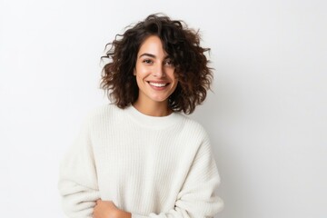 Wall Mural - medium shot portrait of a confident Israeli woman in her 20s wearing a cozy sweater against a white background
