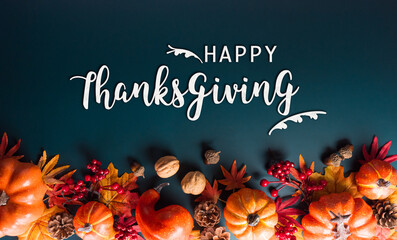 Wall Mural - thanksgiving and autumn decoration concept made from autumn leaves and pumpkin on dark background. f