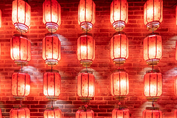 Wall Mural - Red lanterns hung on the wall at night