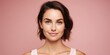 © sandsun - A very beautiful 30-year-old woman with a gentle smile against a pink background. Natural charm and inner beauty. Generative AI