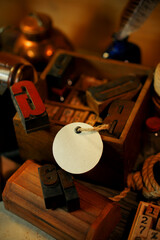 Fototapete - Paper label beside retro type objects and old wooden typographic blocks. Letters and numbers. Vinatage background