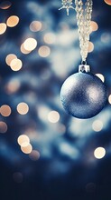 Christmas Ornaments, Blue Baubles Over A Defocused Particles Background. X-Mas Event. 25th December.