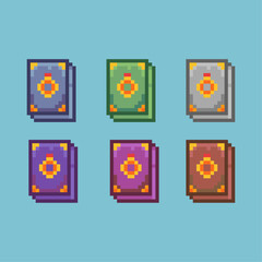 Fototapete - Pixel art sets of magic books ring with variation color item asset. simple bits of book of rings on pixelated style 8bits perfect for game asset or design asset element for your game design asset
