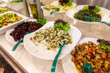 Sticker - Vegetable salad on a plate on a showcase in a restaurant