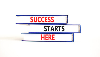 Wall Mural - Success starts here symbol. Concept word Success starts here on beautiful books. Beautiful white table white background. Business motivational success starts here concept. Copy space.