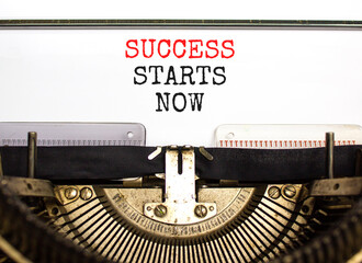 Wall Mural - Success starts now symbol. Concept word Success starts now typed on beautiful retro old typewriter. Beautiful white paper background. Business motivational success starts now concept. Copy space.
