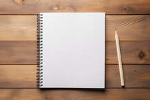Top View Of Open Spiral Blank Paper Notebook With Pencil On Wooden Table Desk Background. Top View