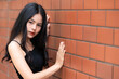 © reewungjunerr - Portrait of hipster girl  on brick wall background,Beautiful asian woman pose for take a photo,Kawaii style