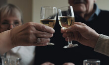 Hands Holding Two Chalices Of Champagne And Toasting. New Year Celebration Concept, Fancy Party Photography