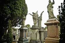 Statues On Graves In Glasnevin Cemetery; Dublin County, Dublin, Ireland