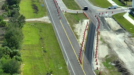 Canvas Print - Construction roadworks on american transport infrastructure. Renovation of highway road with moving traffic. Development of interstate transportation concept