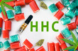 Synthetic Cannabis products flat lay HHC vape cartridge buds and gummy candies on white