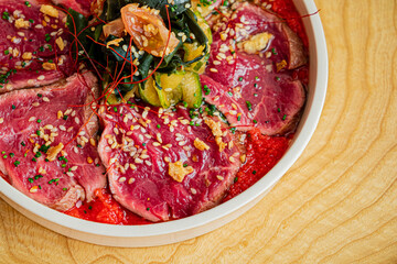 Canvas Print - beef carpaccio on the wooden background