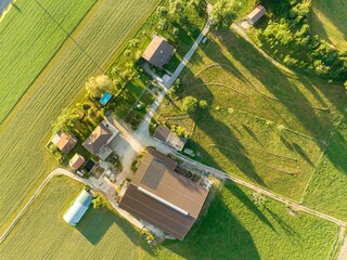 Canvas Print - Aerial view of farmhouse buildings in rural area in Switzerland.