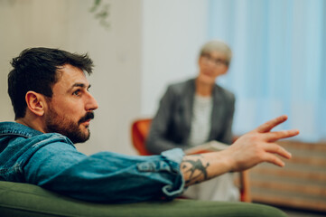 Wall Mural - Patient with problems discussing it on psychotherapy session in the office.