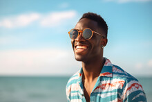 Portrait Of A Happy Laughing Black Man On Beach With Sunglasses Smiling Laughing On Summer Holiday Vacation Travel Lifestyle Freedom Fun. Generative AI