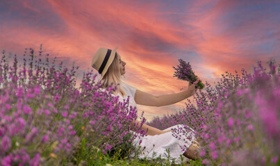 Wall Mural - the girl rests in a lavender field. Selective focus