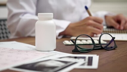 Poster - Medical Workspace Focus: A close-up of a doctor's working table, featuring a jar of pills, vitamins, ultrasound test results, and medical documents, with a pharmacist in the foreground. 