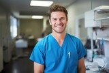 Fototapeta  - handsome male veterinarian in veterinary clinic with blurred background